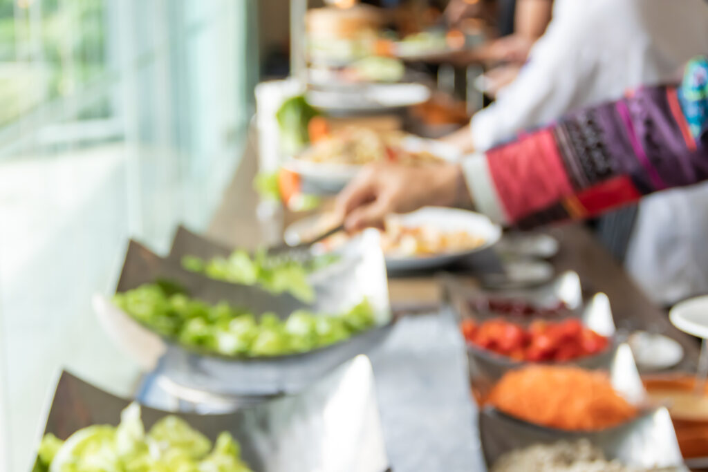 Blurred people take international buffet food in hotel party..food party concept.
